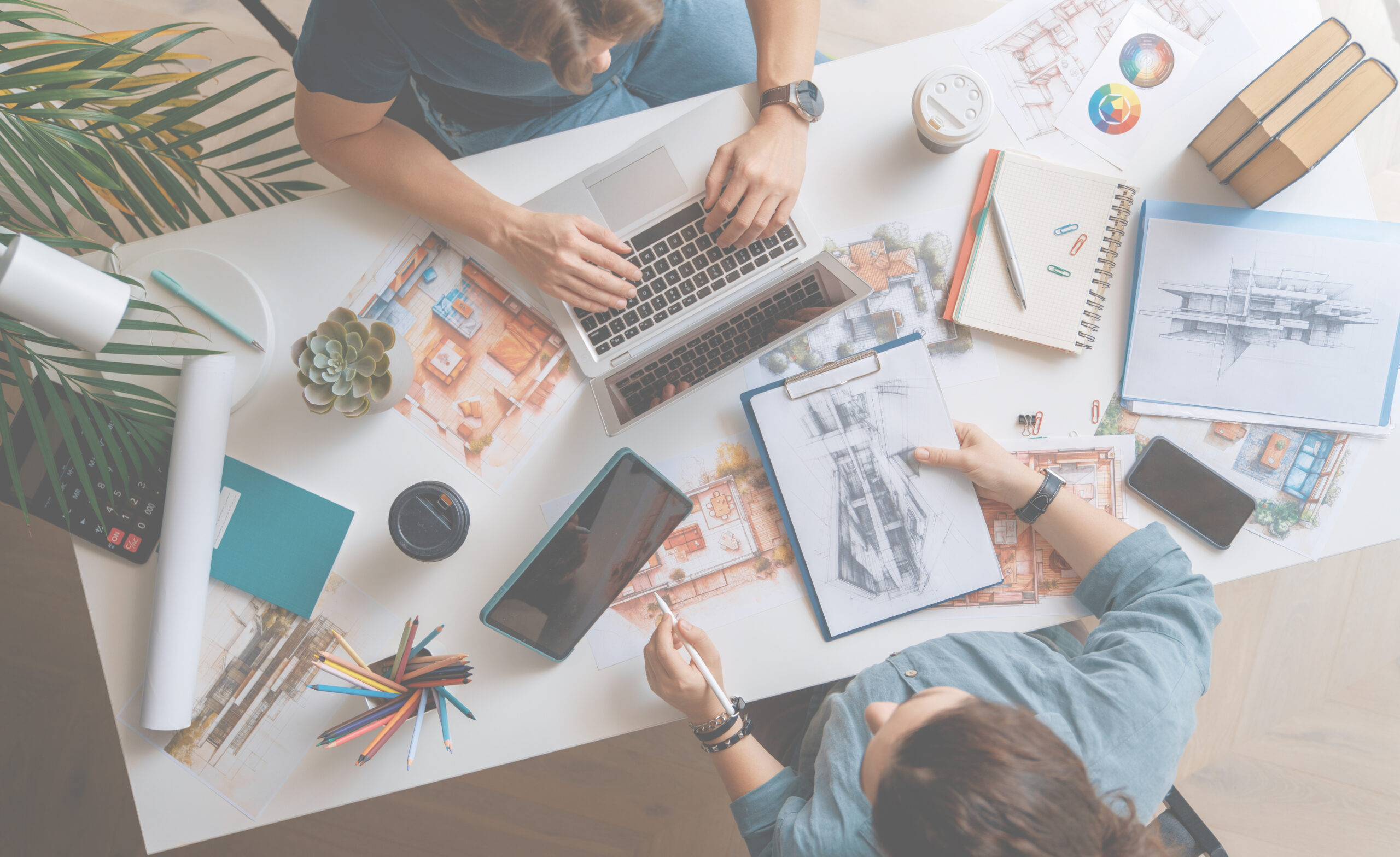 Designers working in studio and using sketches.